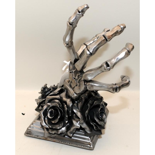 444 - Sculptural Gothic black rose with skeletal hand bottle holder cast in metal. 28cms tall