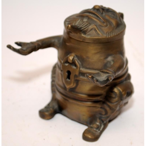 446 - Novelty vintage brass pen holder and inkwell in grotesque form. 9cms tall