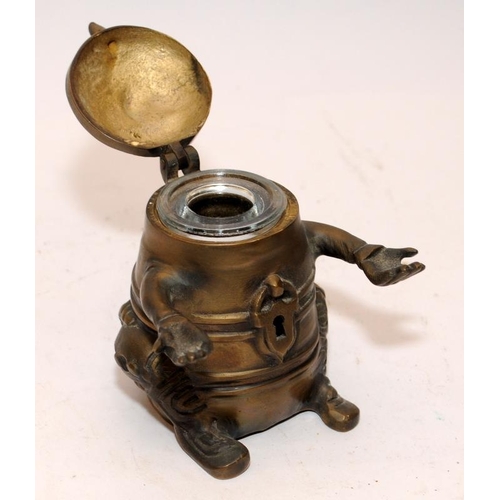 446 - Novelty vintage brass pen holder and inkwell in grotesque form. 9cms tall