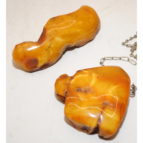 132 - A collection of Chinese amber to include bracelet, pendant, two wood cased items and an amber plaque... 