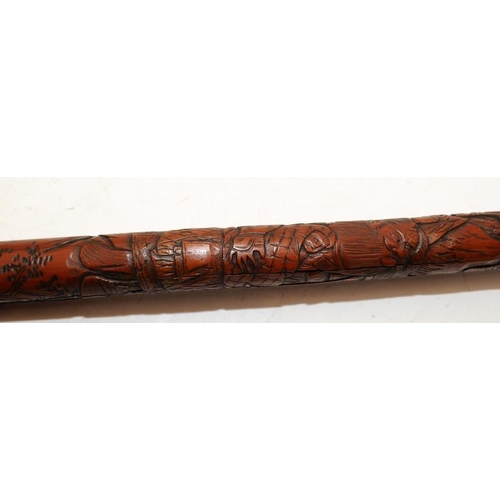 138 - Vintage Oriental bamboo walking stick extensively carved with warriors. 95cms.