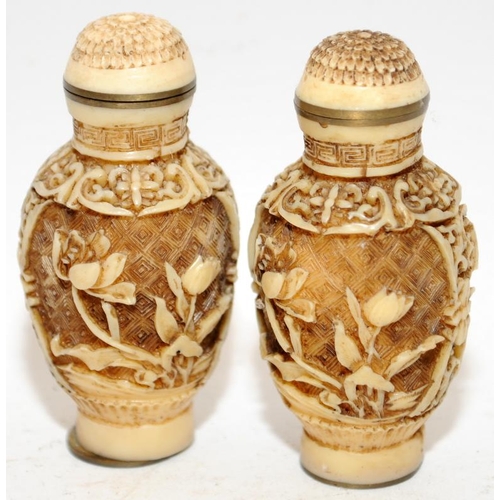 144 - Two Oriental carved scent bottles. 7cm tall