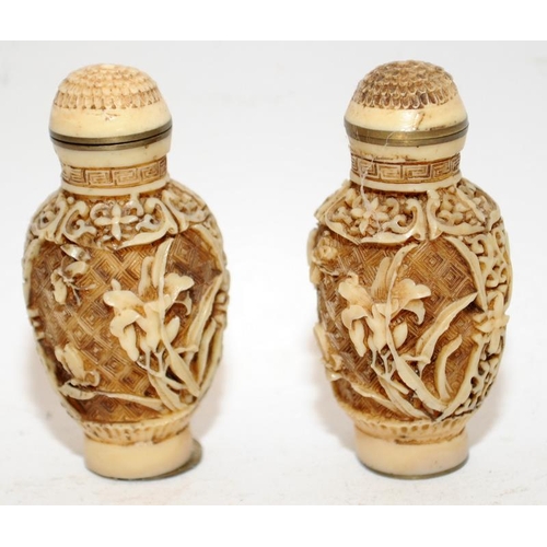 144 - Two Oriental carved scent bottles. 7cm tall