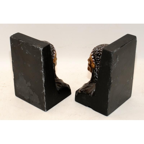 399 - Pair of bookends in the form of Native American busts. 16cms tall.