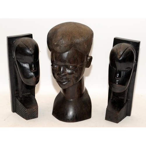 401 - Three hand carved hardwood busts of African figures. One male, two female. Tallest is 27cms