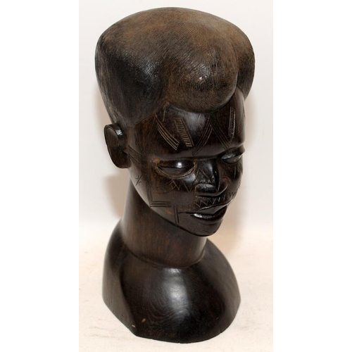 401 - Three hand carved hardwood busts of African figures. One male, two female. Tallest is 27cms