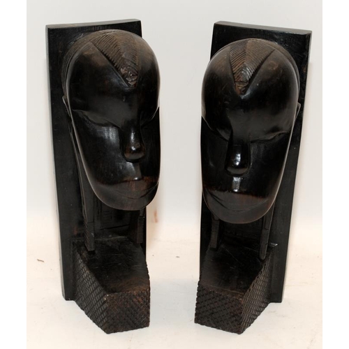 401 - Three hand carved hardwood busts of African figures. One male, two female. Tallest is 27cms