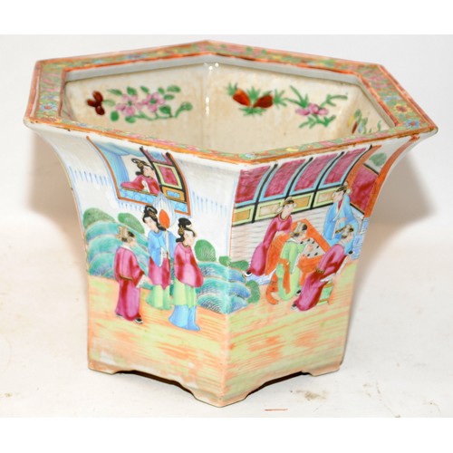 50A - Oriental Famille Rose planter of hexagonal form with garden scenes. 18cms tall