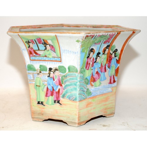 50A - Oriental Famille Rose planter of hexagonal form with garden scenes. 18cms tall