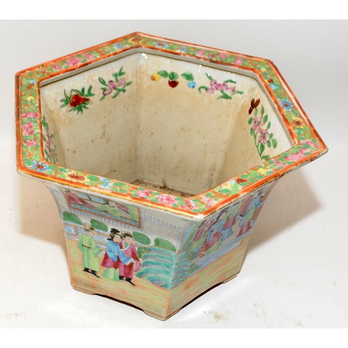 50A - Oriental Famille Rose planter of hexagonal form with garden scenes. 18cms tall