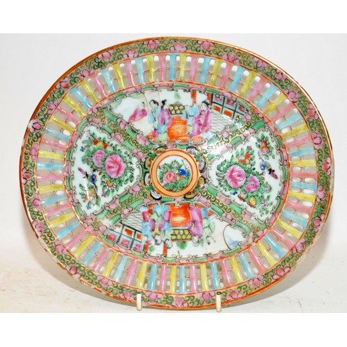 100A - Vintage Oriental Famille Rose oval plate with pierced border around painted scenes. 27cms across