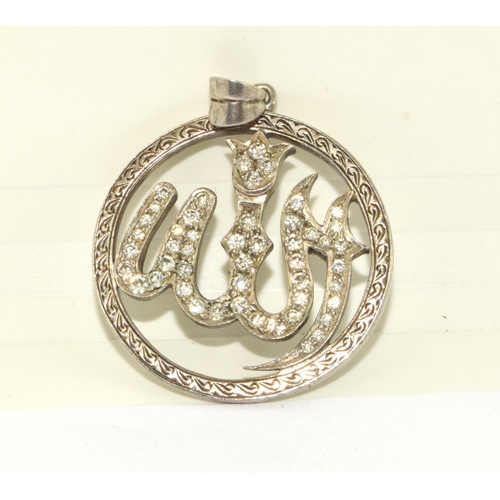 32 - Diamond pendant with embossed edges depicting a possible Arabic serpent approx 1ct diamonds