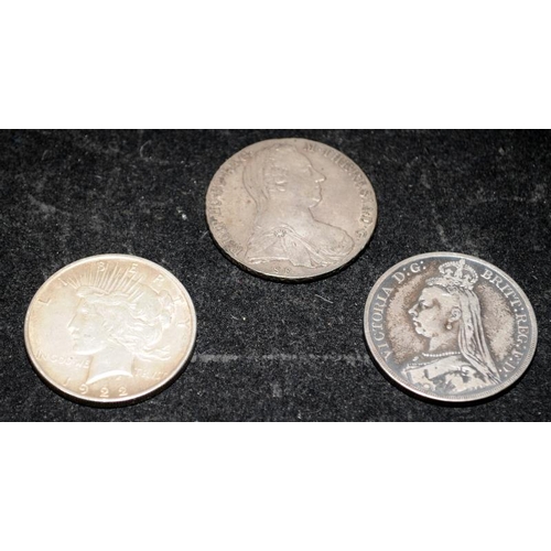 304 - Three silver coins to include an 1889 Victorian Crown, a 1922 Peace Dollar and a Maria Theresa Thale... 