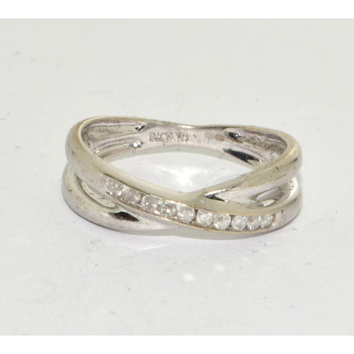 460 - 9ct White Gold Diamond Twist Ring. H/M 0.1ct. Size L