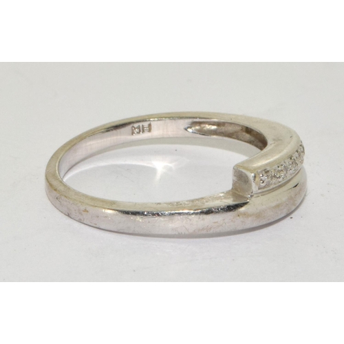 266 - White gold Diamond twist ring in 9ct size O