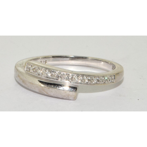 266 - White gold Diamond twist ring in 9ct size O