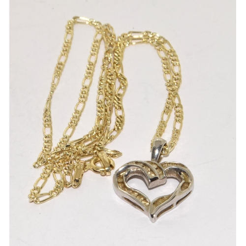 394 - 9ct white gold Diamond heart pendant necklace on a 9ct yellow gold chain