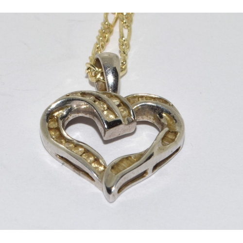 394 - 9ct white gold Diamond heart pendant necklace on a 9ct yellow gold chain