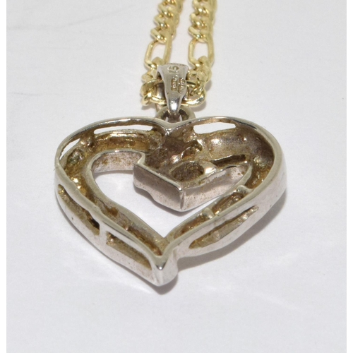 394 - 9ct white gold Diamond heart pendant necklace on a 9ct yellow gold chain