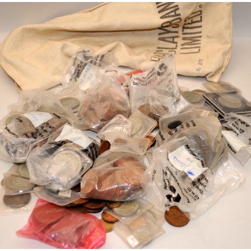 350 - A cloth cash bag containing a quantity of vintage GB coins including silver examples