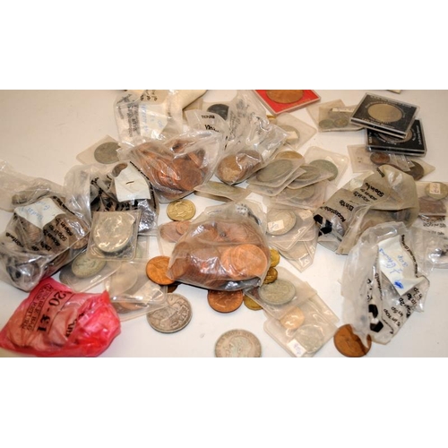 350 - A cloth cash bag containing a quantity of vintage GB coins including silver examples