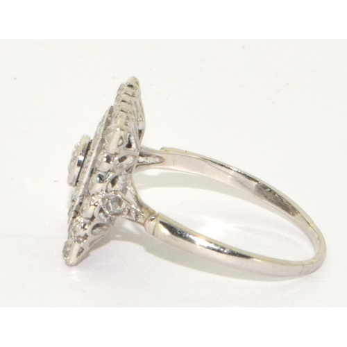 78 - Art Deco design Square cut Diamond ring with raised centre of old Diamond and 16 small grain set old... 