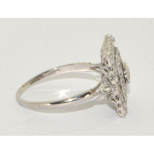 78 - Art Deco design Square cut Diamond ring with raised centre of old Diamond and 16 small grain set old... 