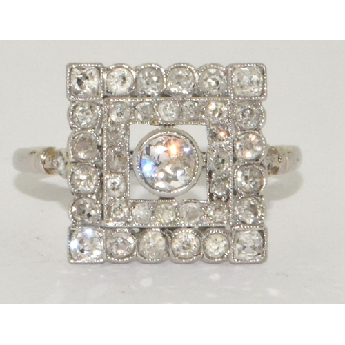 78 - Art Deco design Square cut Diamond ring with raised centre of old Diamond and 16 small grain set old... 