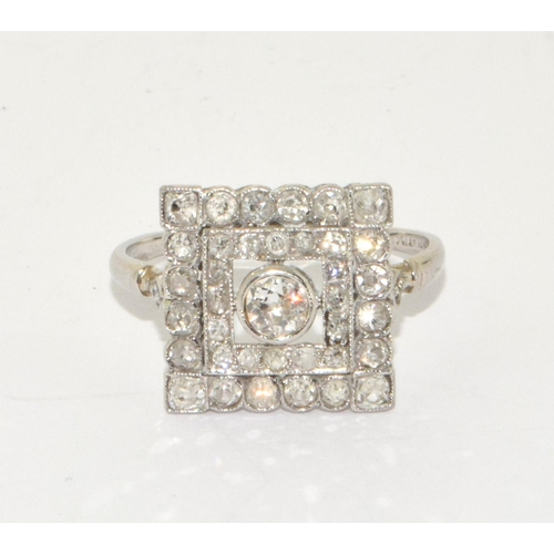 78 - Art Deco design Square cut Diamond ring with raised centre of old Diamond and 16 small grain set old... 