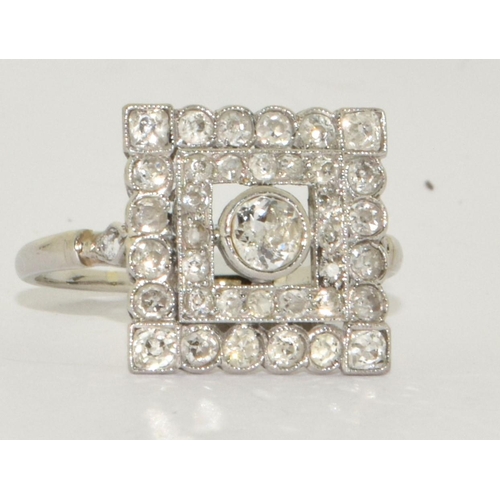 78 - Art Deco design Square cut Diamond ring with raised centre of old Diamond and 16 small grain set old... 