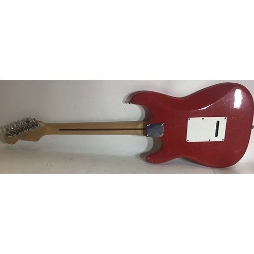 452 - SQUIER FENDER STRATOCASTER. Finished in bright red and missing a couple of strings. Their are some a... 
