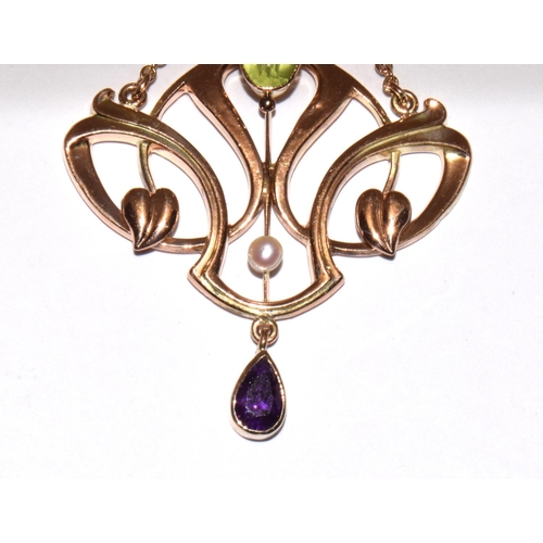 77 - Barnet Henry Joseph 9ct gold Art Nouveau Suffragette pendant set with Peridots, Pearls, and an Ameth... 