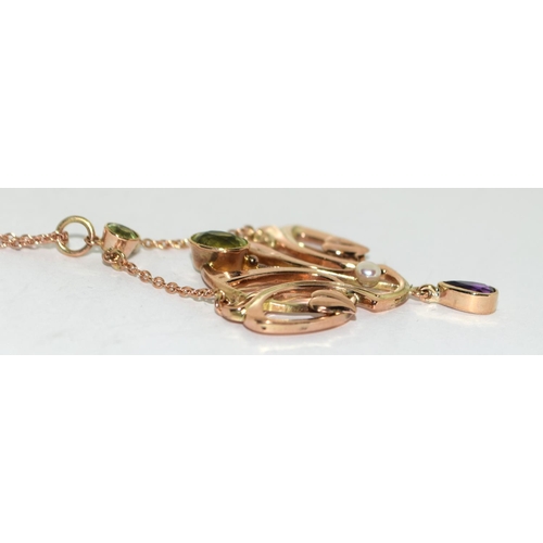 77 - Barnet Henry Joseph 9ct gold Art Nouveau Suffragette pendant set with Peridots, Pearls, and an Ameth... 