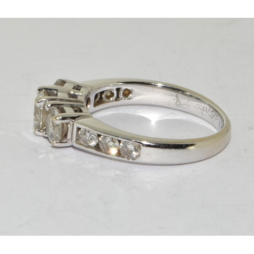 76 - Diamond 3 stone ring with diamond shoulders approx 1.00ct set in 18ct (tested) white gold ring Size ... 