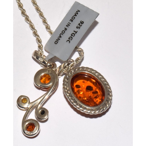 372 - 2 x new baltic amber 925 silver pendants and chain.