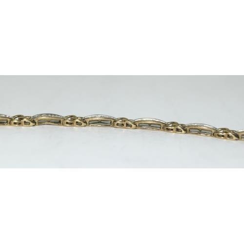 123 - 9ct gold ladies Diamond bracelet set with baguette cut diamonds of approx 2ct total