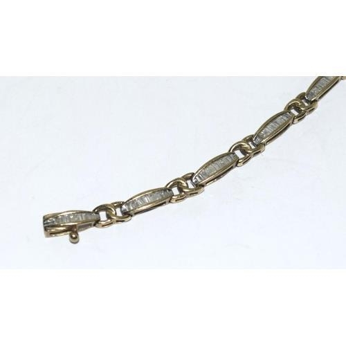 123 - 9ct gold ladies Diamond bracelet set with baguette cut diamonds of approx 2ct total