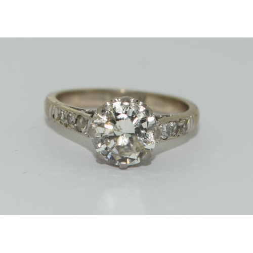 95 - 18ct gold ladies Diamond solitaire ring set with Diamond shoulders a central Old cut diamond of 1.3c... 