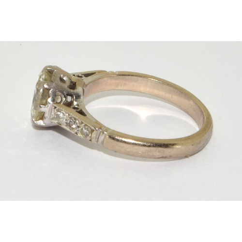 95 - 18ct gold ladies Diamond solitaire ring set with Diamond shoulders a central Old cut diamond of 1.3c... 