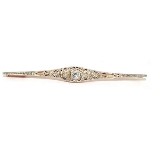 69 - Antique Art Deco Diamond gold and platinum bar brooch. Set with central round cut Diamonds and other... 