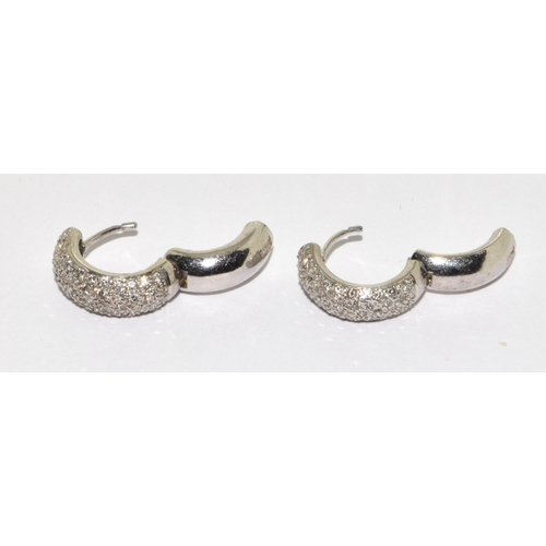 67 - A pair of heavy Pave set Diamond & 18ct gold Huggy earrings