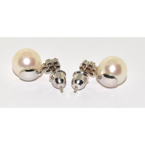 74 - Pair of Cultured Pearl and Diamond cluster earrings in 18ct gold