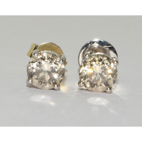 84 - Diamond earrings approx 0.33 points each set in 18ct gold.