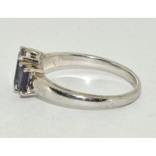 300 - A 925 silver and lavender stone trilogy ring Size R