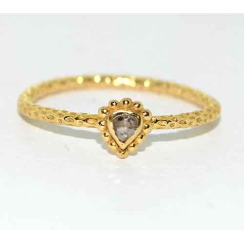 80 - An 18ct gold and diamond limited edition Satya ring Size N