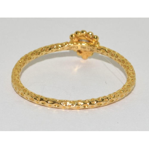 80 - An 18ct gold and diamond limited edition Satya ring Size N