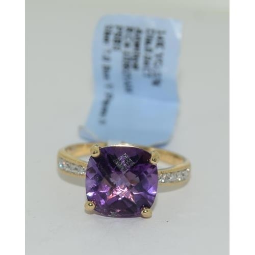 148 - 14ct gold ladies new with tags Amethyst and Diamond ring size N tag price $2400