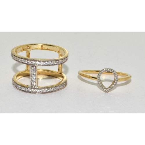 249 - Two modernist CZ gold on 925 silver rings size P 1/2 and R 1/2.