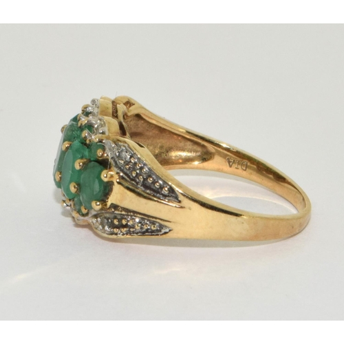 305 - 9ct gold ladies Diamond and Emerald ring H/M as diamond size M