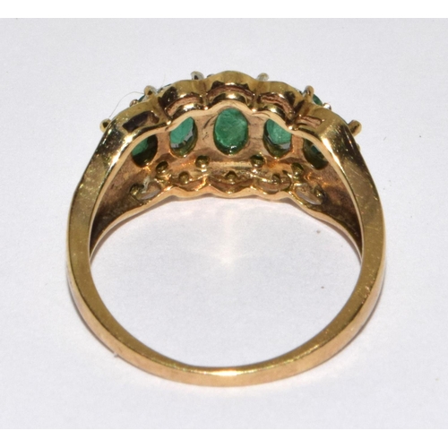 305 - 9ct gold ladies Diamond and Emerald ring H/M as diamond size M